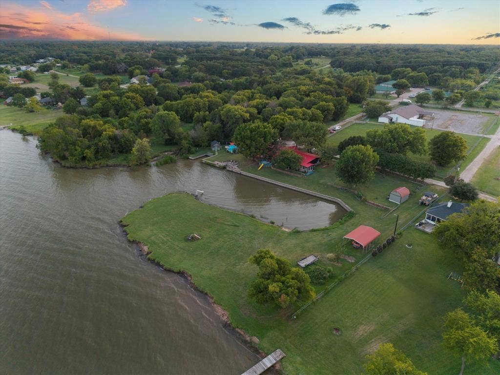 308 Causeway Cove, Seven Points, TX 75143 Expansive waterfront property with a private pond, green space, and mature trees