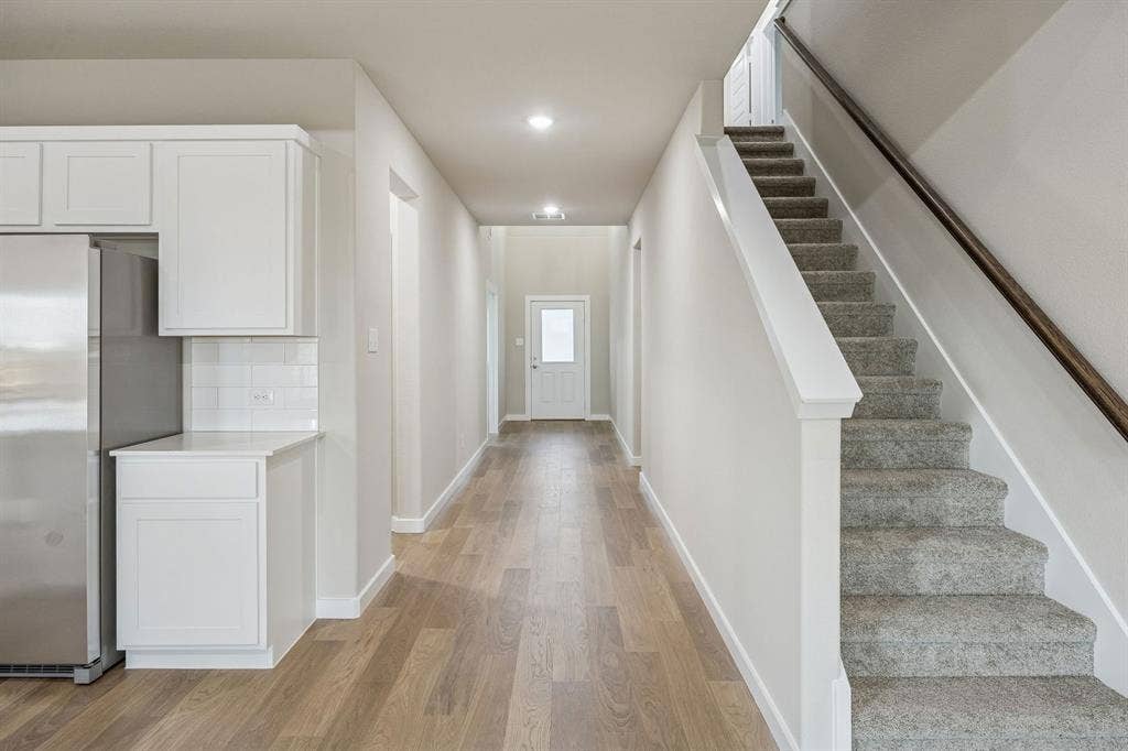 290 Hope Orchards Drive, Lavon, TX 75166 Entryway in the Wimbledon home plan by Trophy Signature Homes – REPRESENTATIVE PHOTO