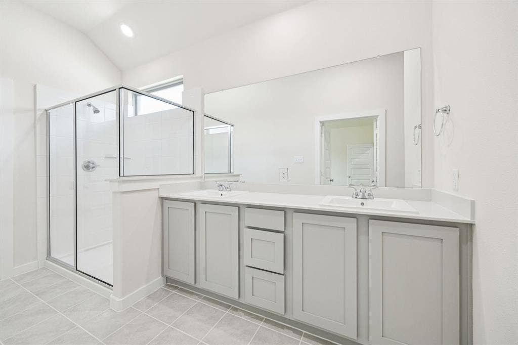 Primary Bathroom in the Claret home plan by Trophy Signature Homes – REPRESENTATIVE PHOTO