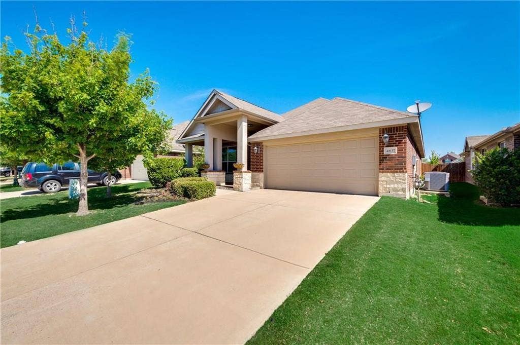 4637 Dwarf Nettle Drive, Fort Worth, TX 76244 Brick and stone exterior with a covered front entry