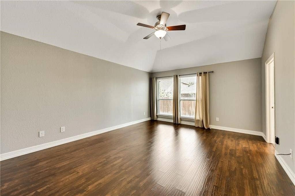 4637 Dwarf Nettle Drive, Fort Worth, TX 76244 Vaulted ceiling, ceiling fan with integrated lighting, wood-finish flooring, and dual windows