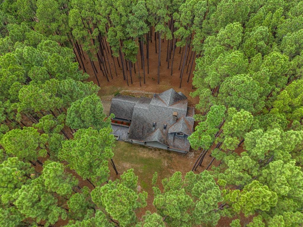 Nestled in 4 acres of beautiful trees.