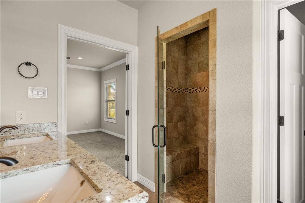 3674 County Road 2142, Caddo Mills, TX 75135 Shower with tiled walls, integrated bench, and mosaic accent