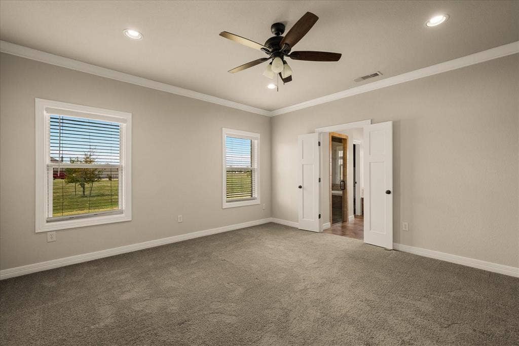 3674 County Road 2142, Caddo Mills, TX 75135 Recessed lighting, ceiling fan with light fixture, dual windows, neutral wall tones, and carpeted flooring