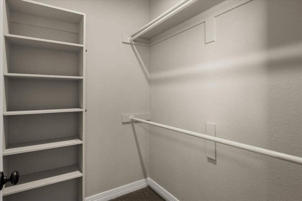 3674 County Road 2142, Caddo Mills, TX 75135 Built-in shelving, two clothing rods, and carpeting