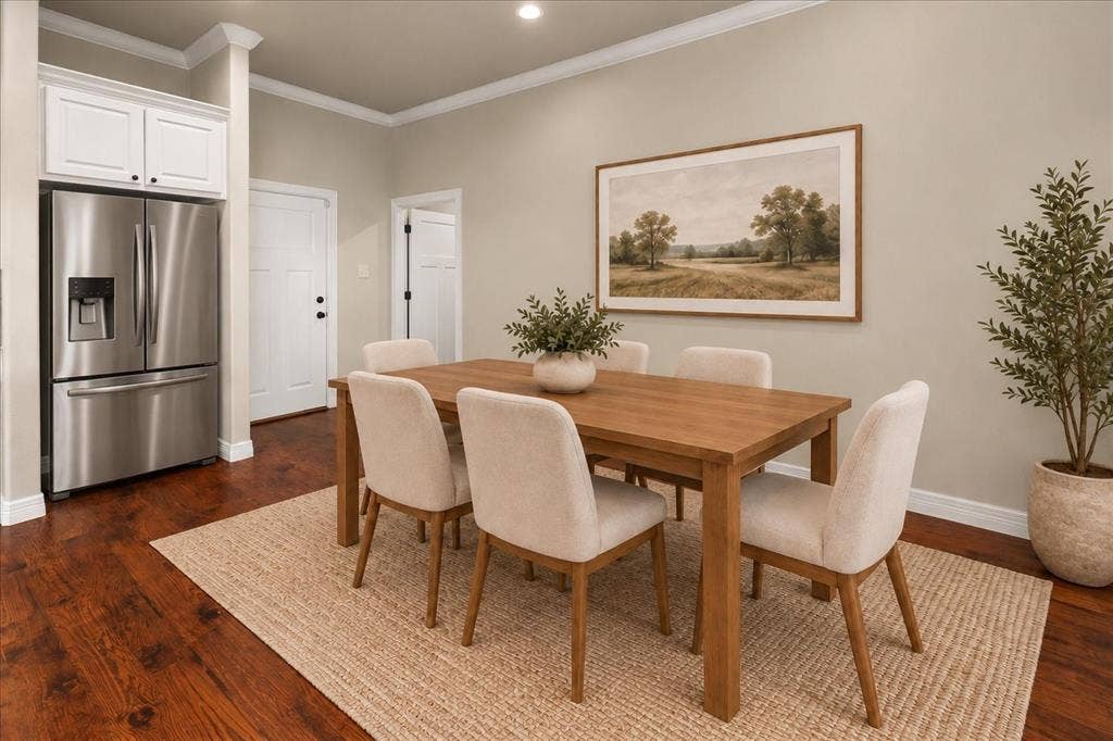 3674 County Road 2142, Caddo Mills, TX 75135 Wood-finish flooring, stainless steel refrigerator, white cabinetry, crown molding, and recessed lighting