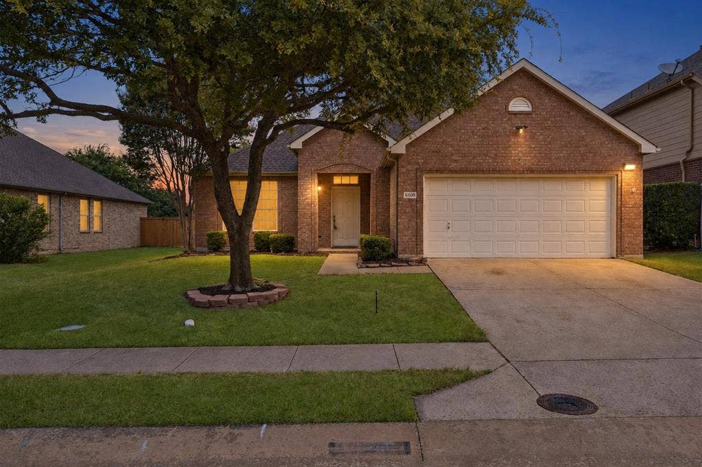 6508 Courtyards Drive, McKinney, TX 75072 Brick exterior with attached two-car garage
