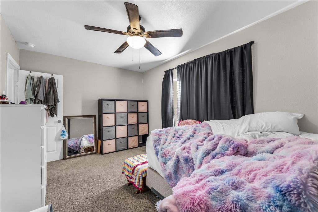 3605 Rolando Avenue, Waco, TX 76711 Carpeted flooring, ceiling fan with integrated lighting, window with dark drapes, light neutral wall paint