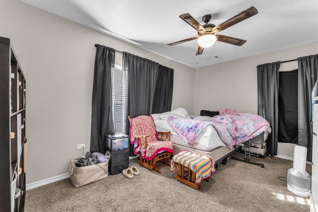 3605 Rolando Avenue, Waco, TX 76711 Carpeted flooring, neutral wall tones, and an integrated ceiling fan with lighting
