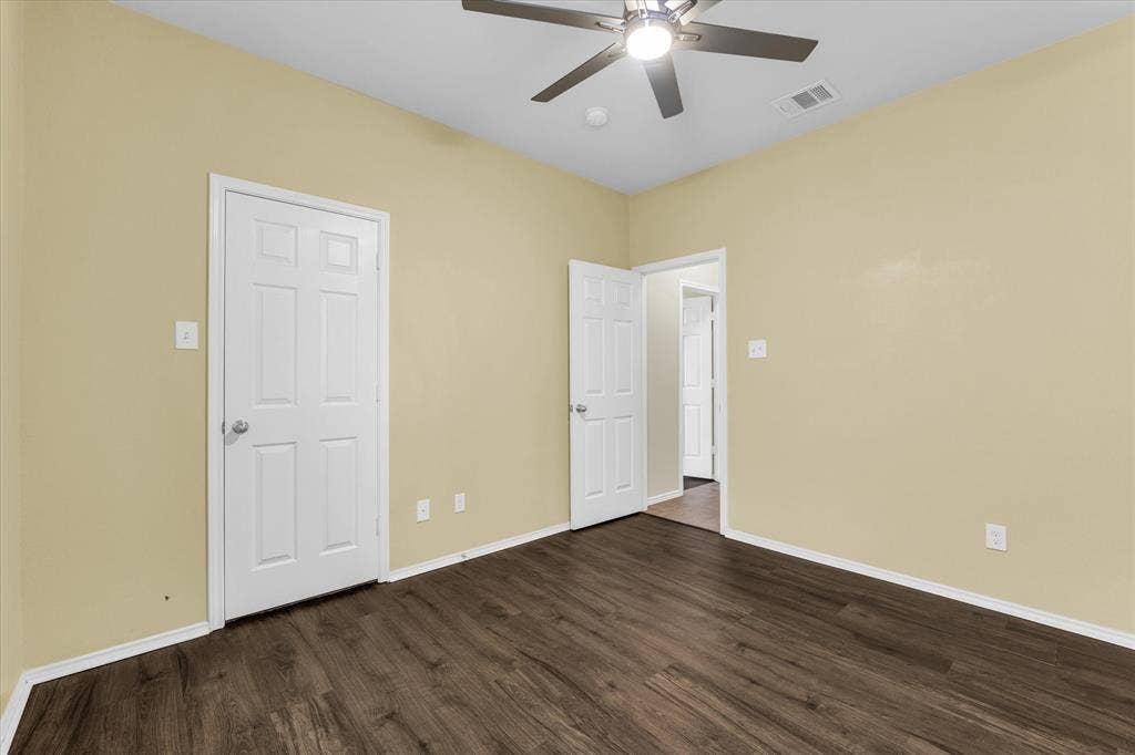6621 Burling Street, Waco, TX 76712 High ceilings with a ceiling fan, wood-finish flooring, and light-colored walls