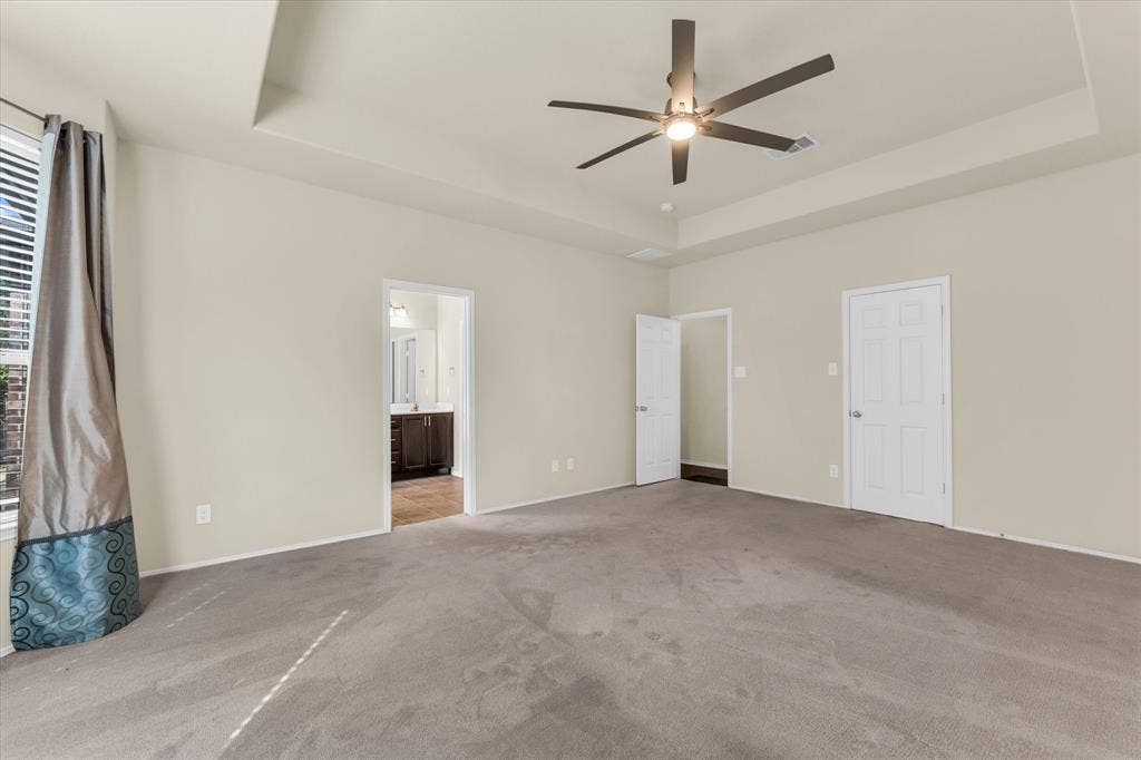 6621 Burling Street, Waco, TX 76712 Recessed tray ceiling with a modern ceiling fan and integrated lighting