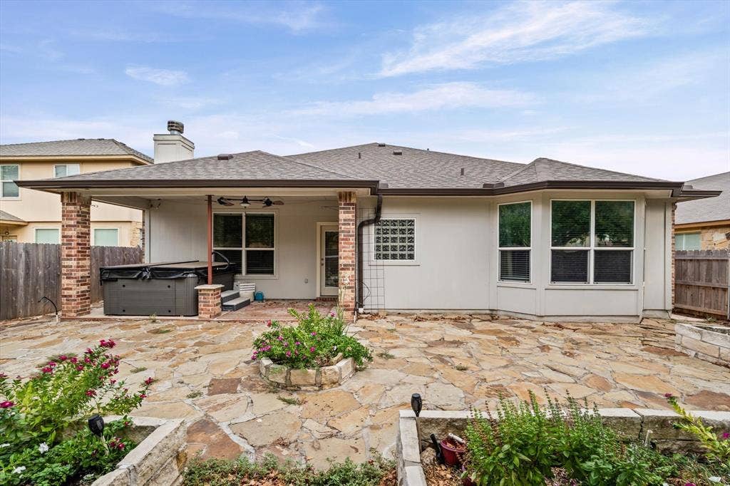 6621 Burling Street, Waco, TX 76712 Expansive flagstone patio with a covered outdoor living area featuring brick columns