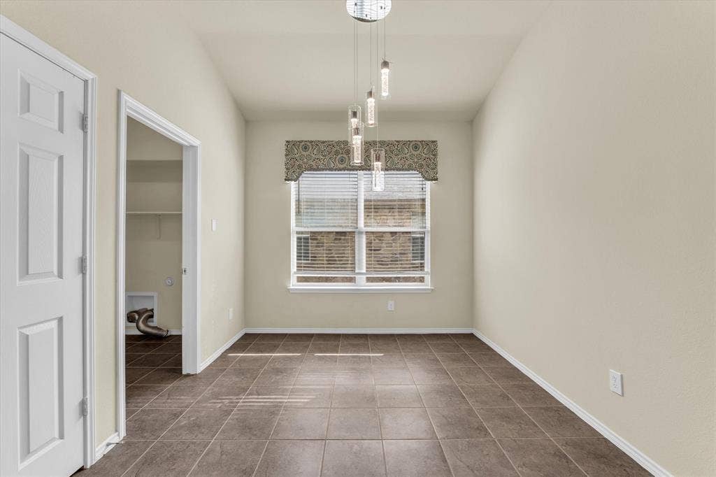 6621 Burling Street, Waco, TX 76712 Recessed window with blinds, modern pendant lighting fixture, and durable tile flooring