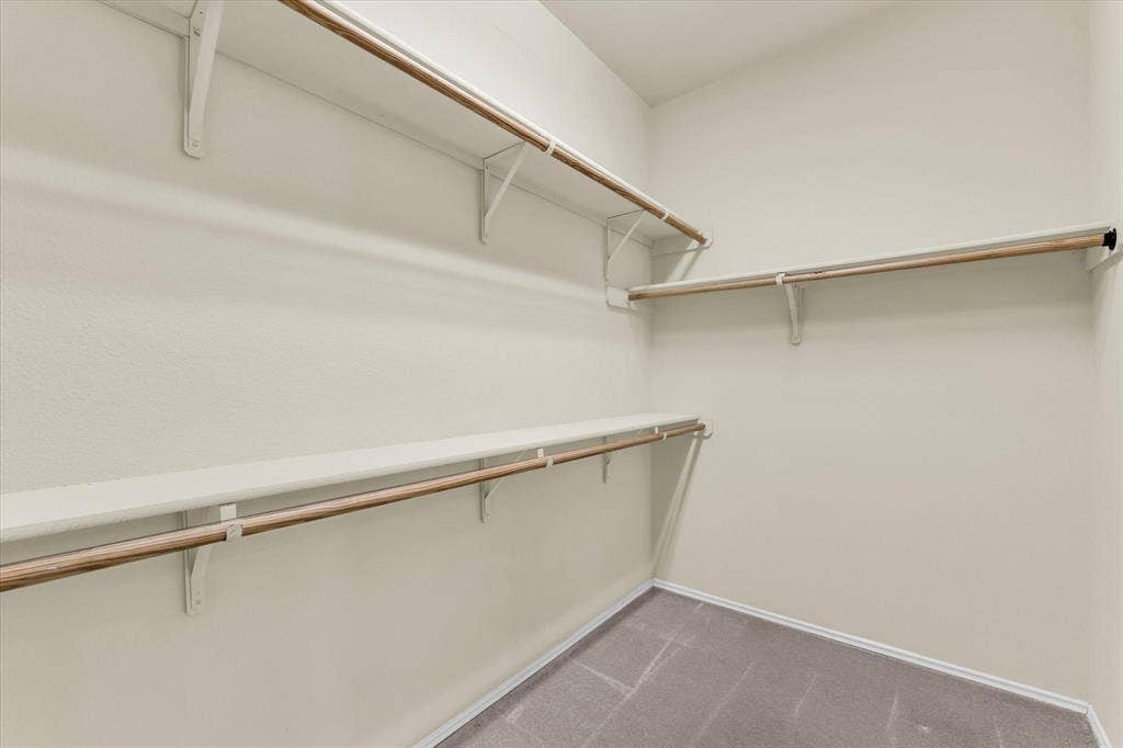 6621 Burling Street, Waco, TX 76712 Walk-in closet with multiple shelving units and clothing rods