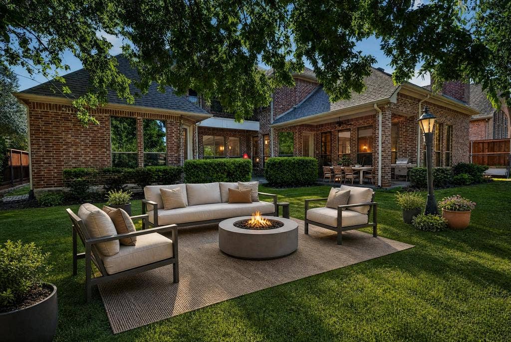 112 Winsley Circle, McKinney, TX 75071 Water View. Virtually Staged Expansive backyard featuring a covered patio, and mature trees.