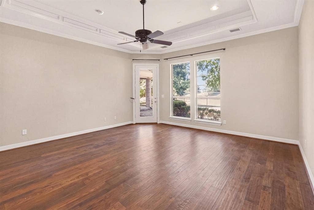 112 Winsley Circle, McKinney, TX 75071 Spacious primary bedroom with water view and patio access.