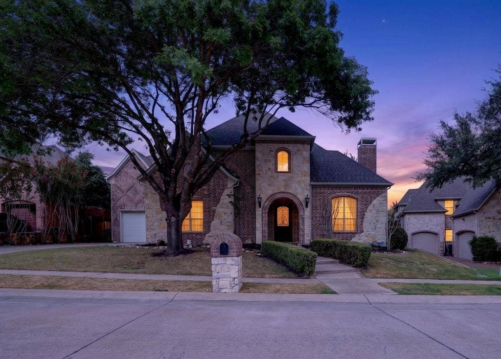 112 Winsley Circle, McKinney, TX 75071 Brick and stone exterior with arched entry