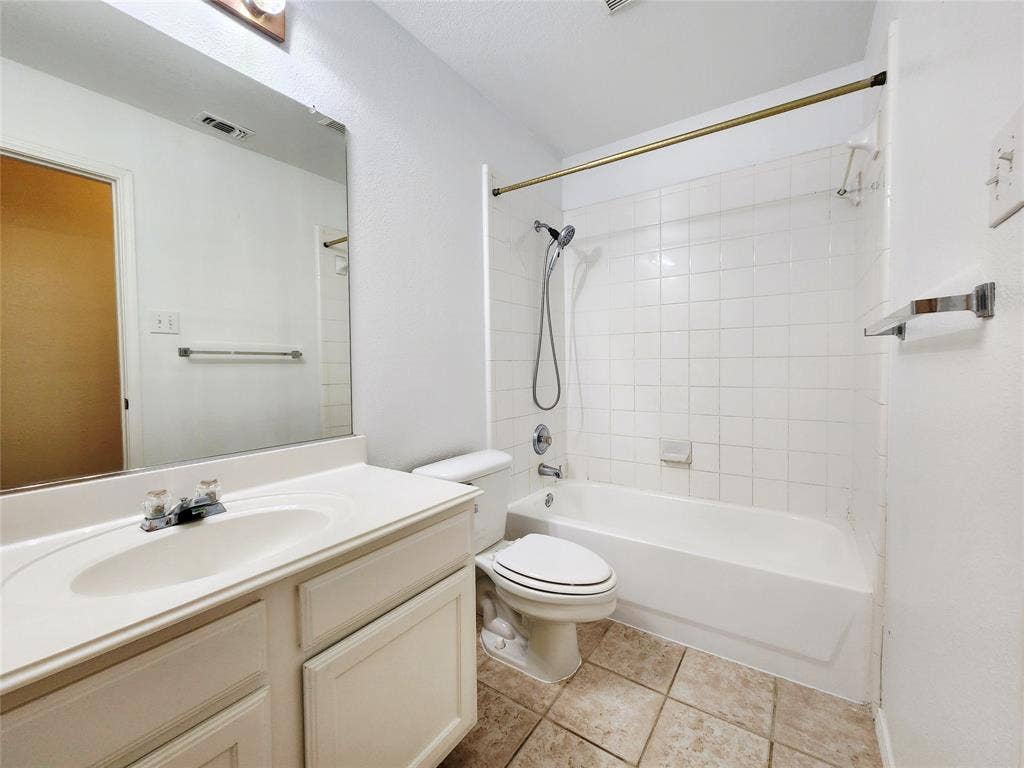 10307 Asheboro Street, Frisco, TX 75035 White vanity with an integrated sink and chrome faucet