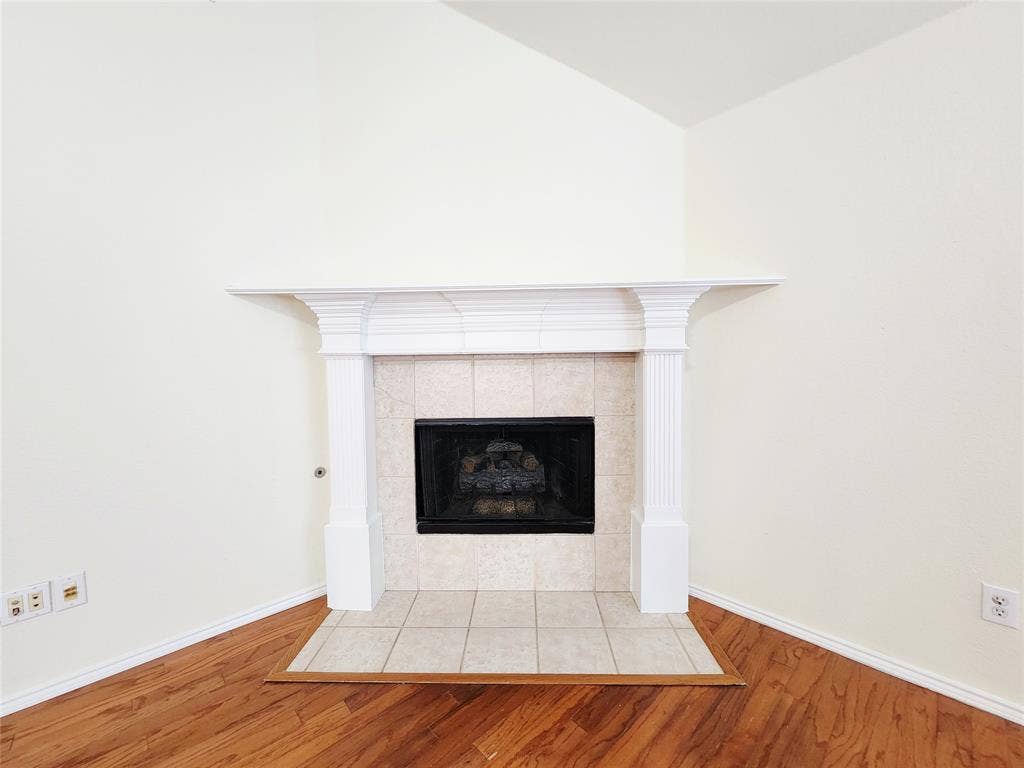 10307 Asheboro Street, Frisco, TX 75035 Fireplace with a white mantel, tile surround, and tile hearth