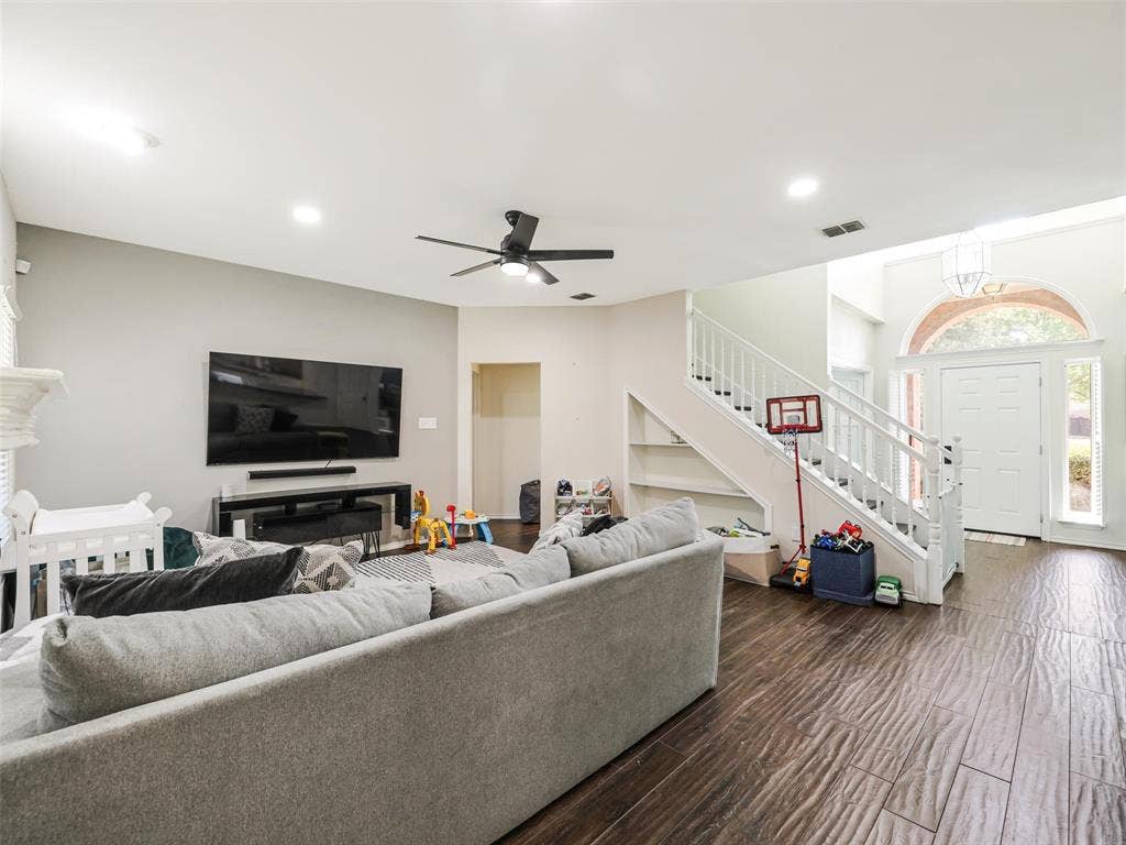 1206 Bel Air Drive, Allen, TX 75013 Wood-finish flooring, recessed lighting, and a white staircase with built-in shelving