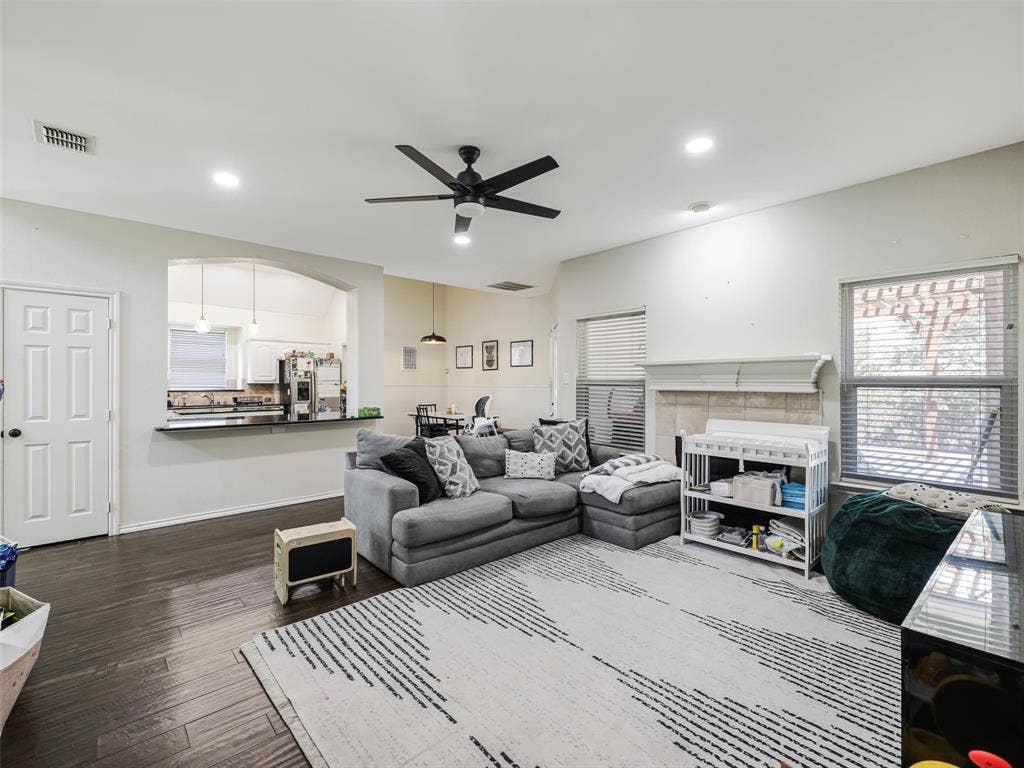 1206 Bel Air Drive, Allen, TX 75013 Spacious living area featuring wood-finish flooring, recessed lighting, and a ceiling fan