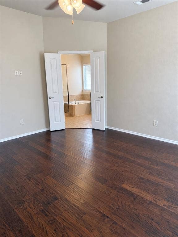 9609 Sand Trap Drive, McKinney, TX 75072 Rich wood-finish flooring, ceiling fan with integrated lighting, and neutral wall tones
