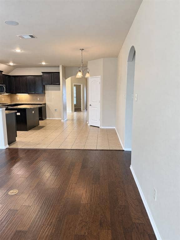 9609 Sand Trap Drive, McKinney, TX 75072 Wood-finish flooring, recessed lighting, and an arched entry