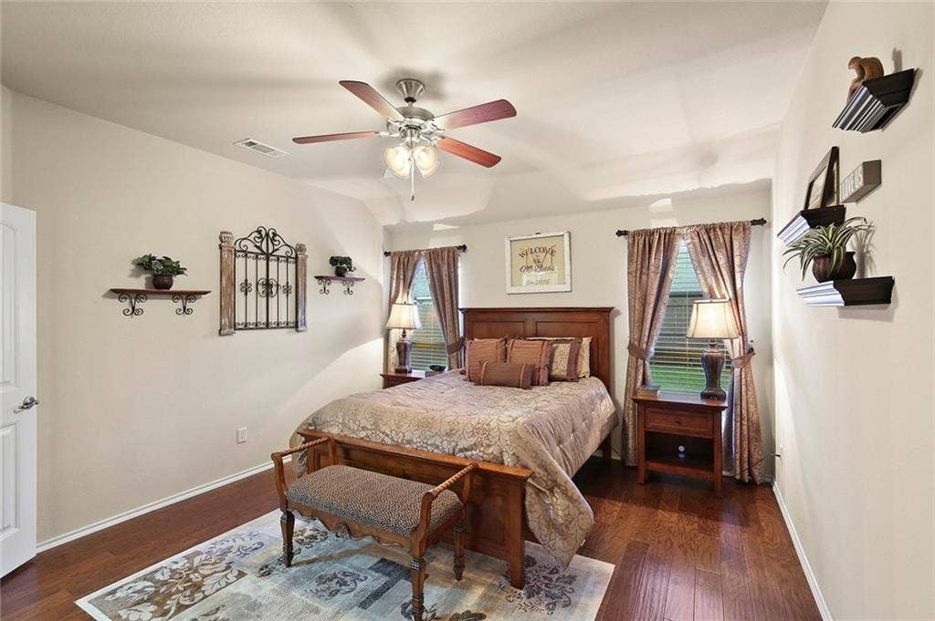 9609 Sand Trap Drive, McKinney, TX 75072 Wood-finish flooring, ceiling fan, and painted walls