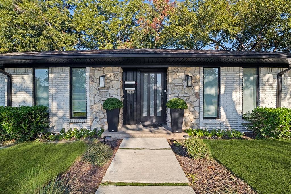 5021 Ashbrook Road, Dallas, TX 75227 Stone and brick exterior with a black trim roofline