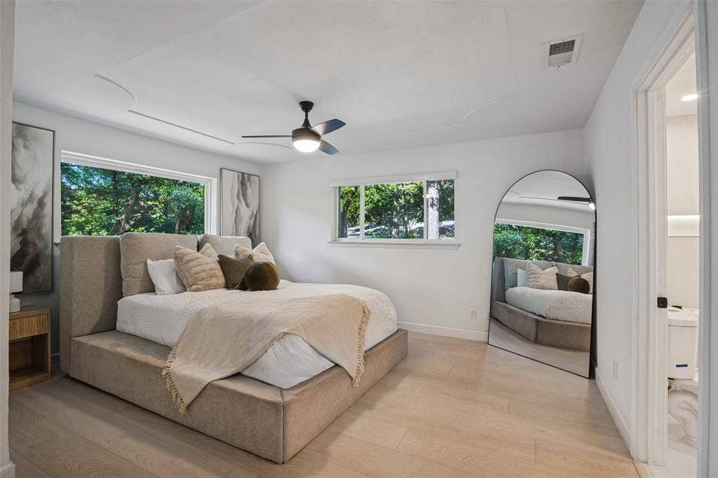 5021 Ashbrook Road, Dallas, TX 75227 Recessed ceiling with decorative detailing, wood-finish flooring, and a ceiling fan with integrated lighting