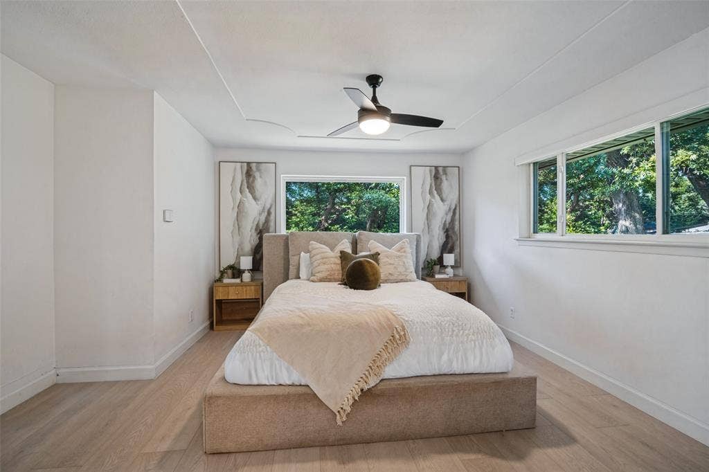 5021 Ashbrook Road, Dallas, TX 75227 Recessed ceiling, wood-finish flooring, white walls, multiple windows, ceiling fan with integrated lighting