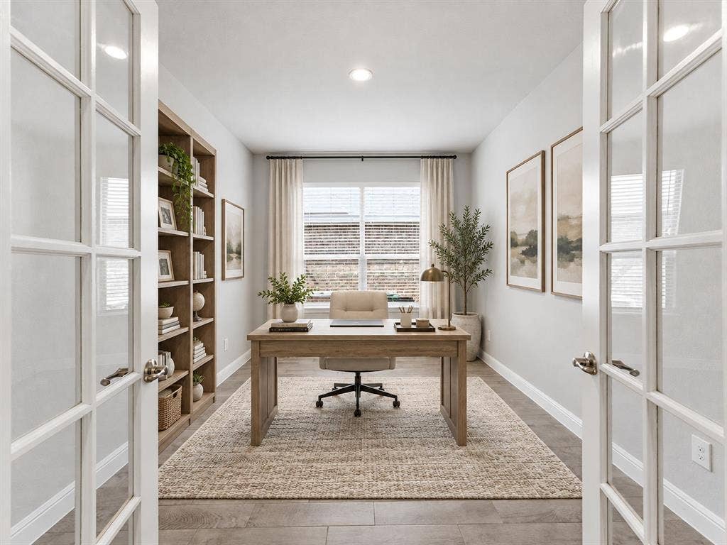 French doors leading into a room with wood-finish flooring, a built-in shelving unit, and a window with blinds
