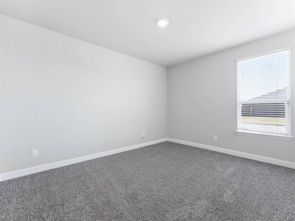 Recessed ceiling lighting, a single window with blinds, light gray wall finishes, and gray carpeting