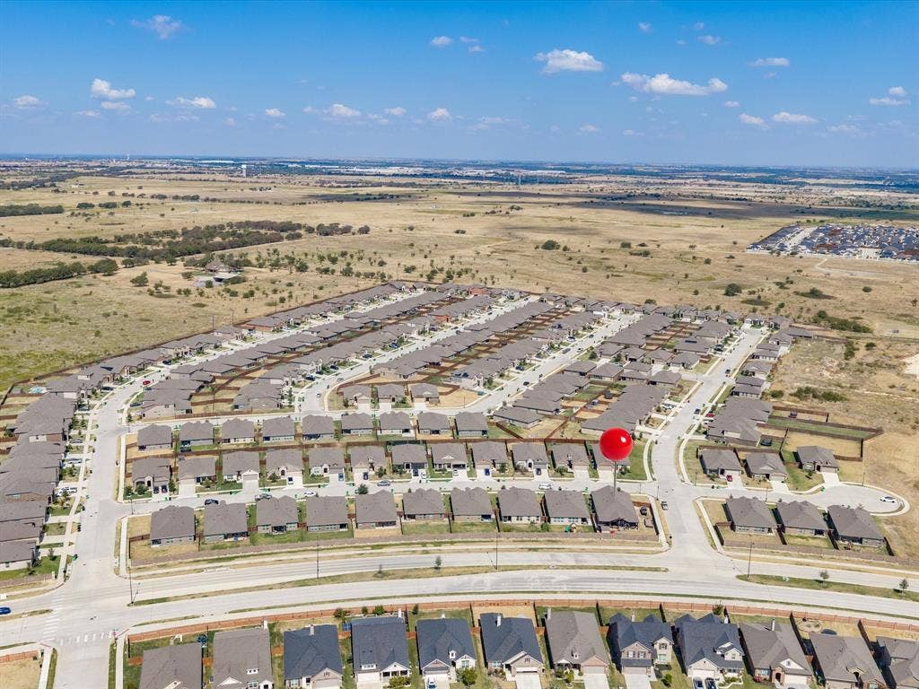 Expansive residential neighborhood with uniform housing and paved roadways