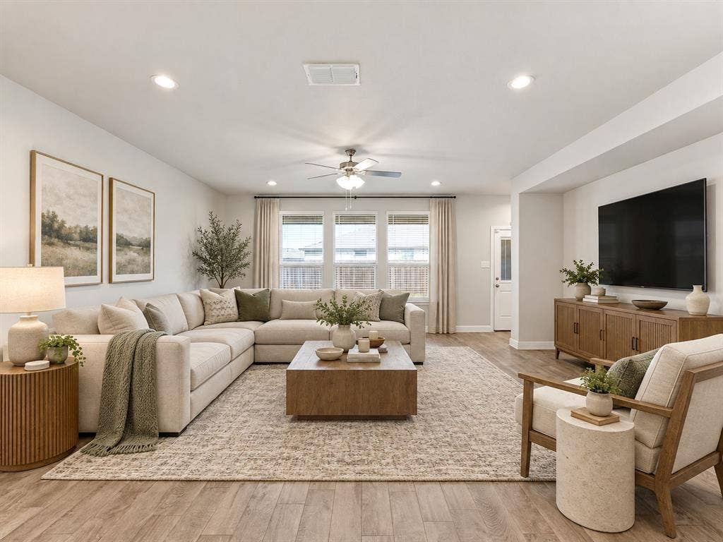 Recessed ceiling lighting, wood-finish flooring, ceiling fan, multiple windows with blinds, and painted walls