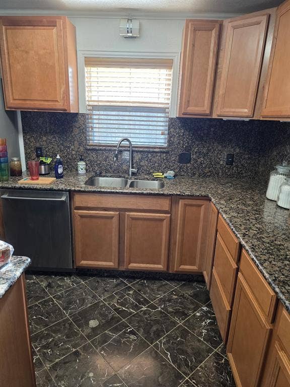1608 University Drive, Richardson, TX 75081 Kitchen featuring marble finish floor, decorative backsplash, a sink, and dishwasher