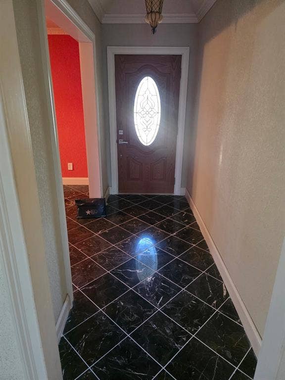 1608 University Drive, Richardson, TX 75081 Entrance foyer featuring crown molding, baseboards, and marble finish floor