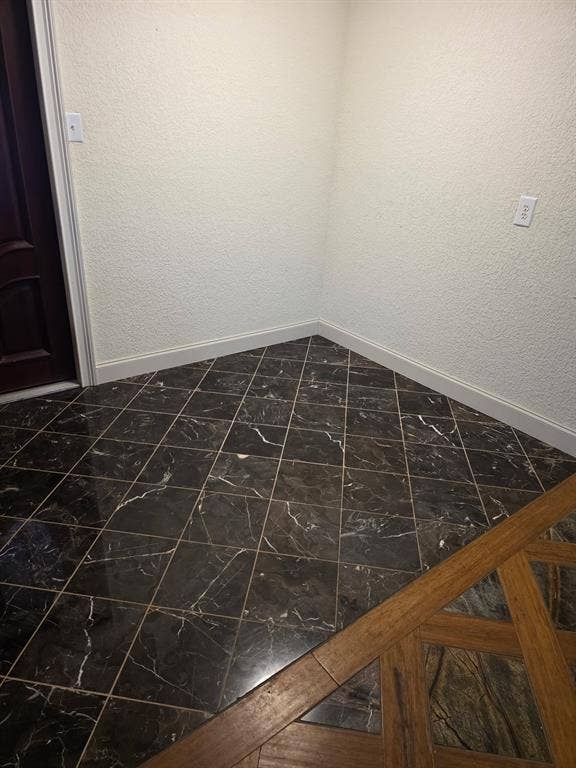1608 University Drive, Richardson, TX 75081 Empty room with baseboards