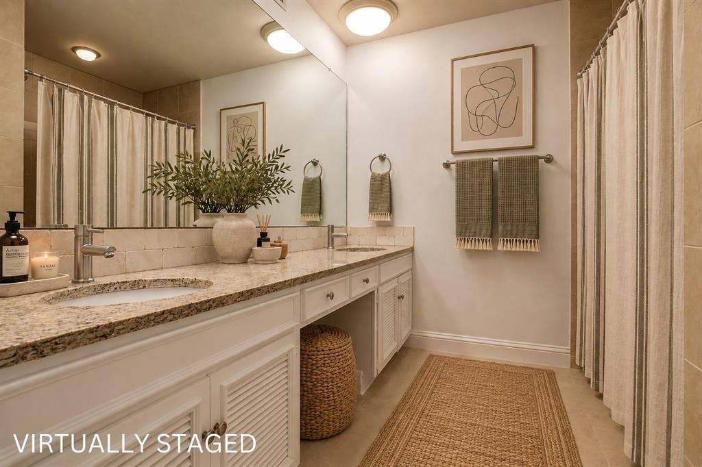 Dual vanity with stone-finish countertop, undermount sinks, and chrome fixtures