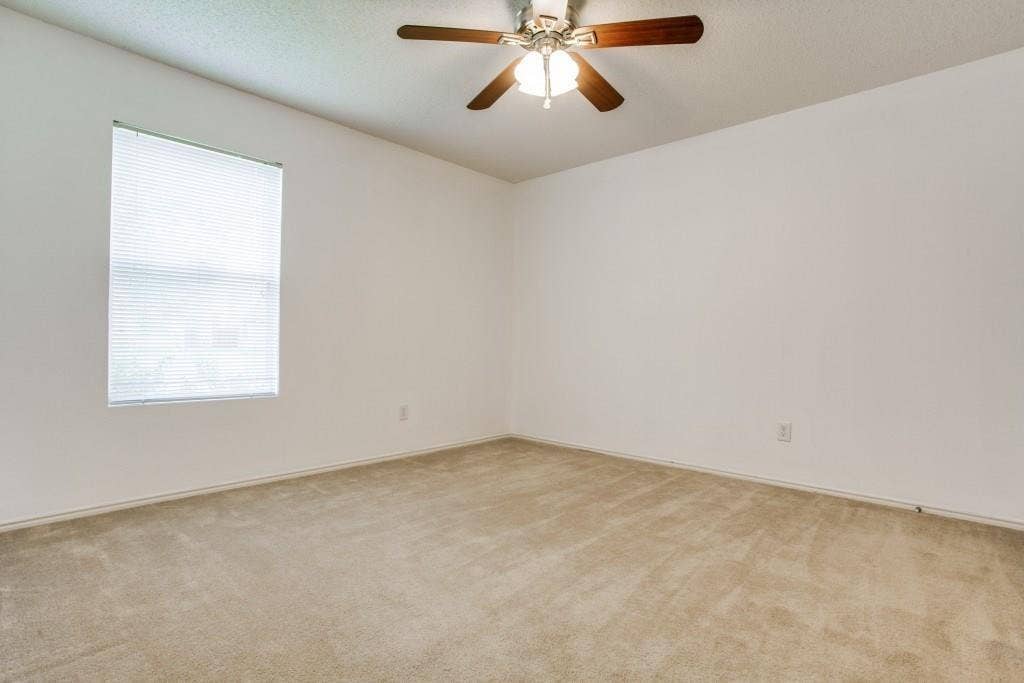 2800 Bissell Way, Wylie, TX 75098 Recessed window with blinds, overhead ceiling fan with light fixture, light-colored carpeting, and painted walls