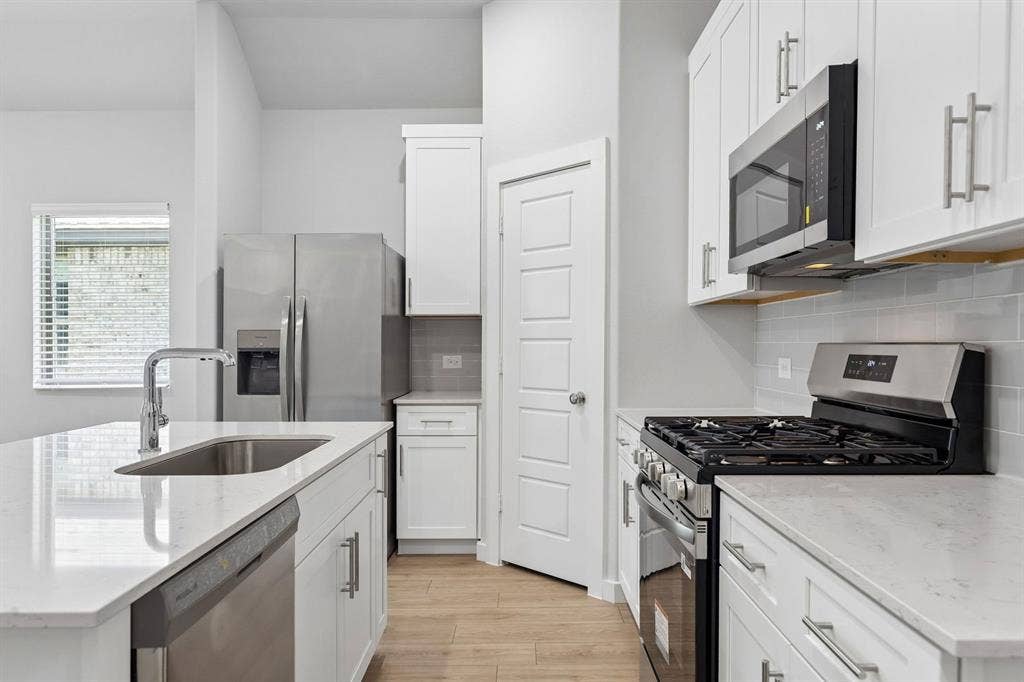 Kitchen in the Cypress home plan by Trophy Signature Homes - REPRESENTATIVE PHOTO