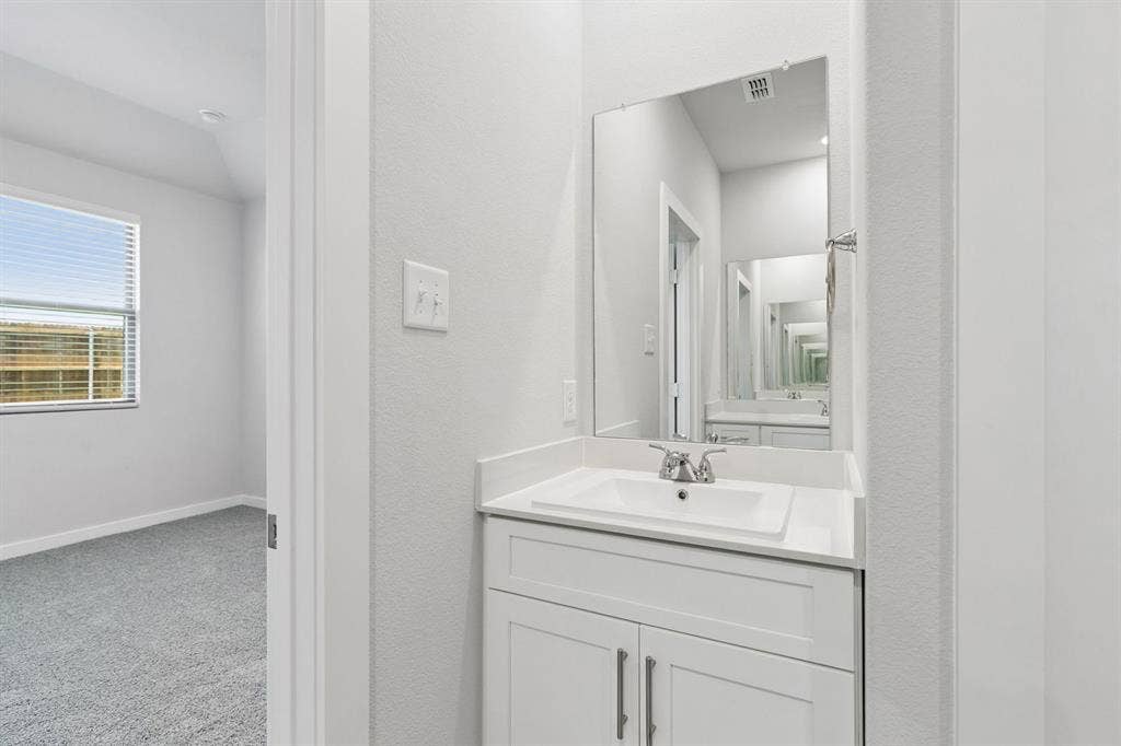 Primary Bathroom in the Cypress home plan by Trophy Signature Homes - REPRESENTATIVE PHOTO