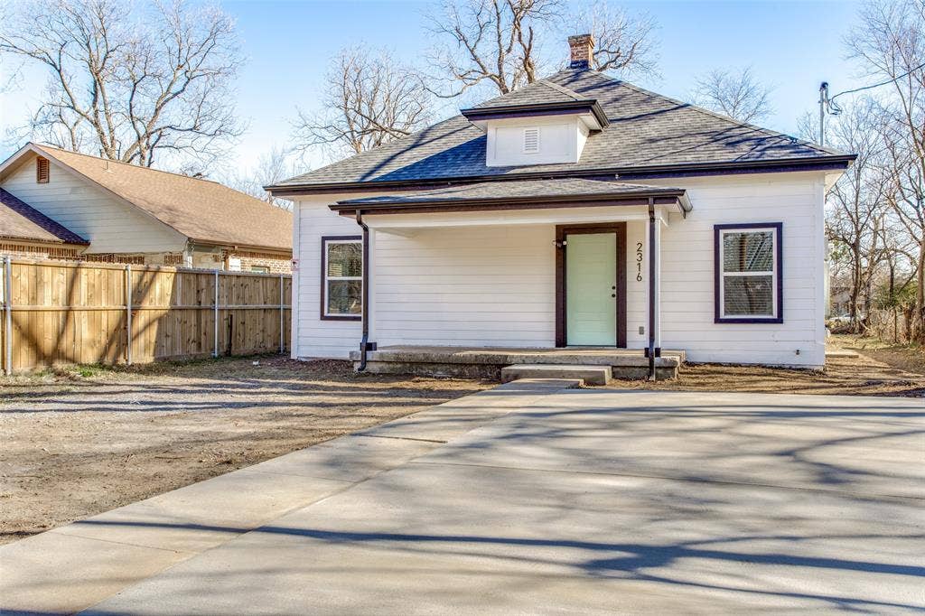 2316 Marburg Street, Dallas, TX 75215 View of front facade with a chimney, fence, and roof with shingles