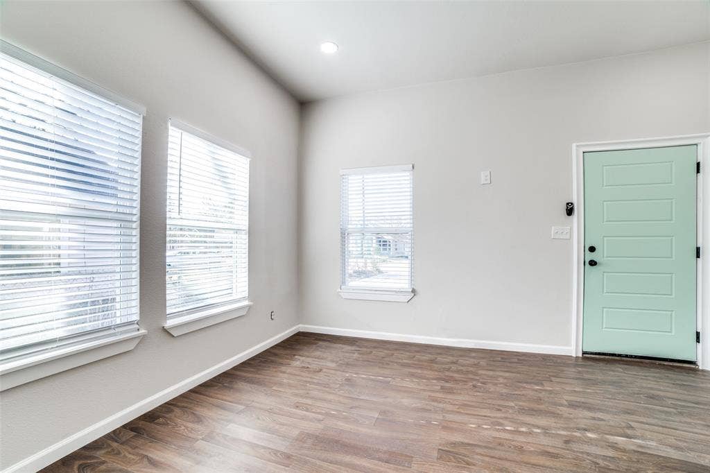 2316 Marburg Street, Dallas, TX 75215 Foyer entrance with baseboards and wood finished floors