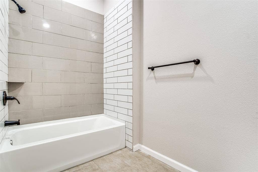2316 Marburg Street, Dallas, TX 75215 Bathroom with tile patterned flooring, tub / shower combination, and baseboards
