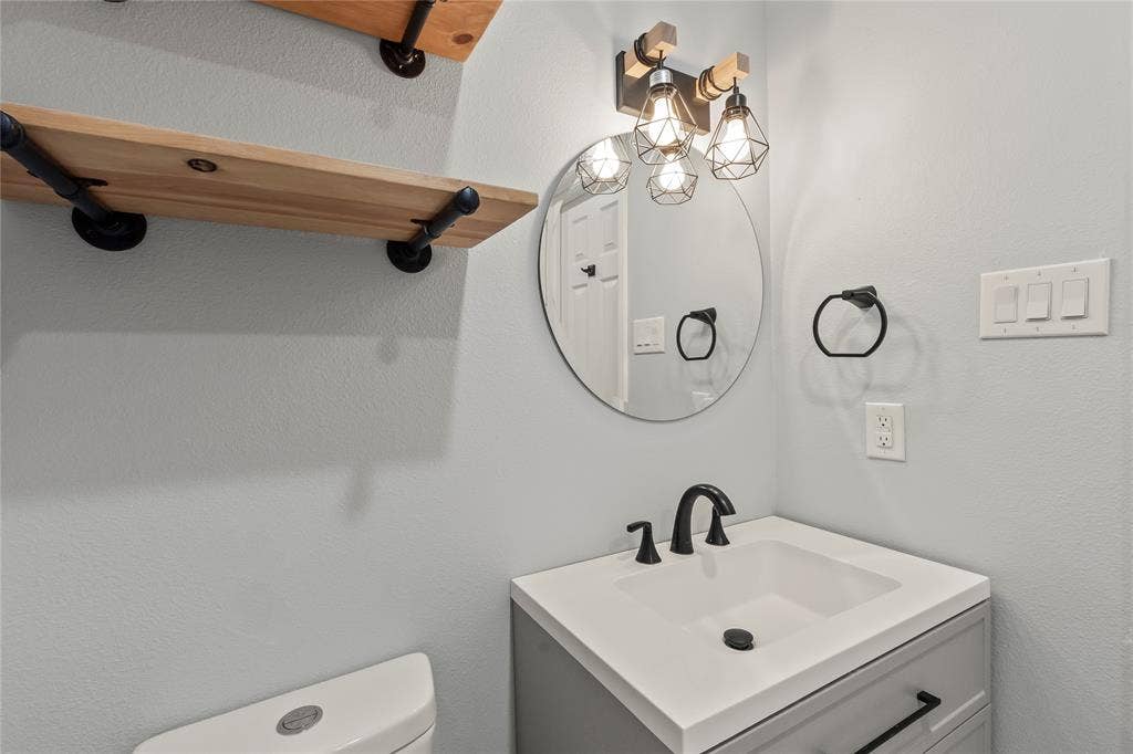 110 Henderson Harbor Circle, Payne Springs, TX 75156 Vanity with integrated sink, matte black faucet, and cabinet storage