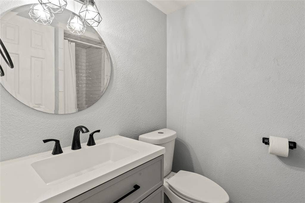 110 Henderson Harbor Circle, Payne Springs, TX 75156 Modern vanity with an integrated sink, matte black faucet, and gray cabinetry
