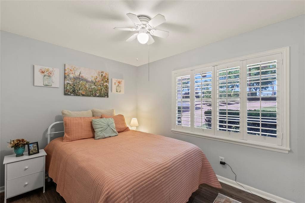 110 Henderson Harbor Circle, Payne Springs, TX 75156 White plantation shutters, wood-finish flooring, and a ceiling fan with integrated lighting