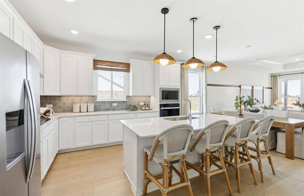 3421 Majesty Lane, Denton, TX 76208 *Model Representation - Large island overlooking gathering room and dining areas