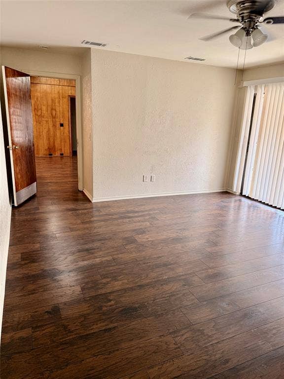 Spacious primary bedroom with sliding glass door to the backyard and patio.